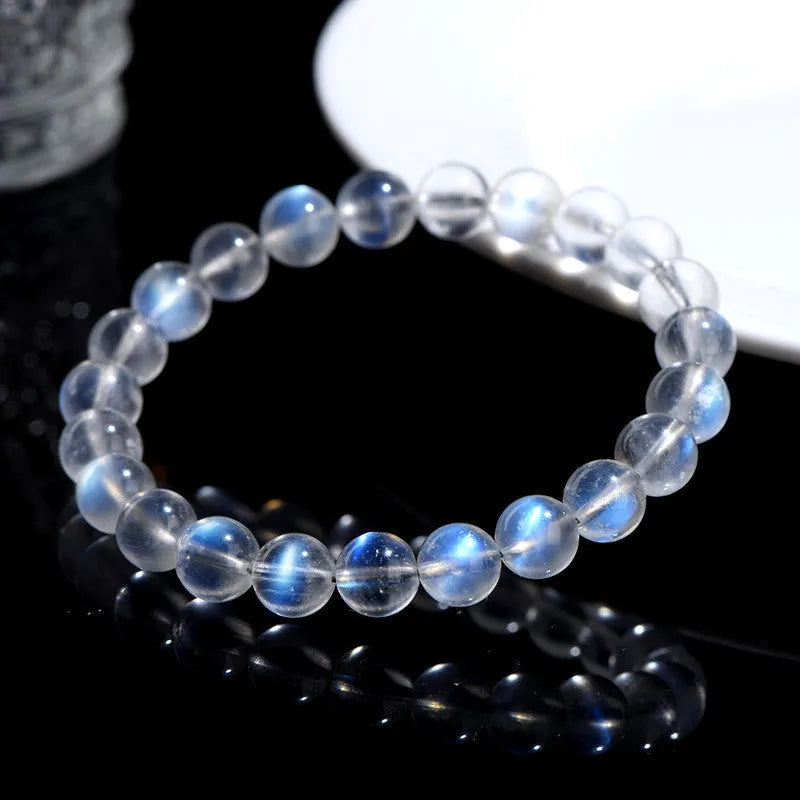 Natural crystal blue moonlight bracelet with grinding treatment showing multiple diameter options on wrist