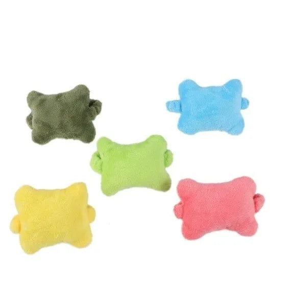Plush wrist protector mouse pad in blue, green, or pink colour options on a desk.