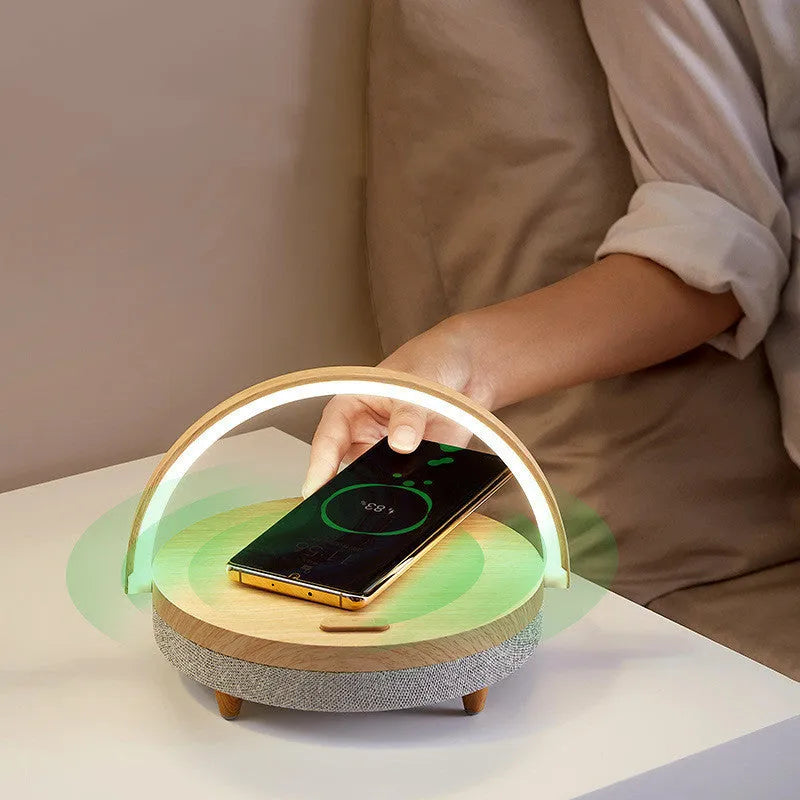 Wireless charging LED night light with Bluetooth speaker and phone holder in marble or wood grain finish
