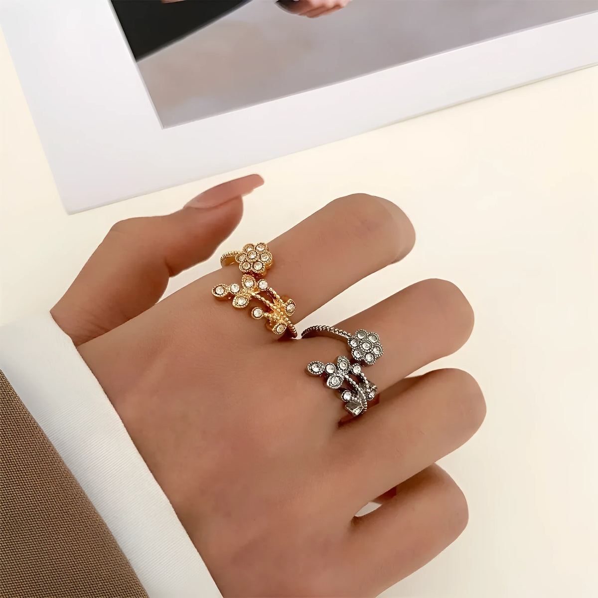 Copper open ring with flower and leaf design in gold colour.