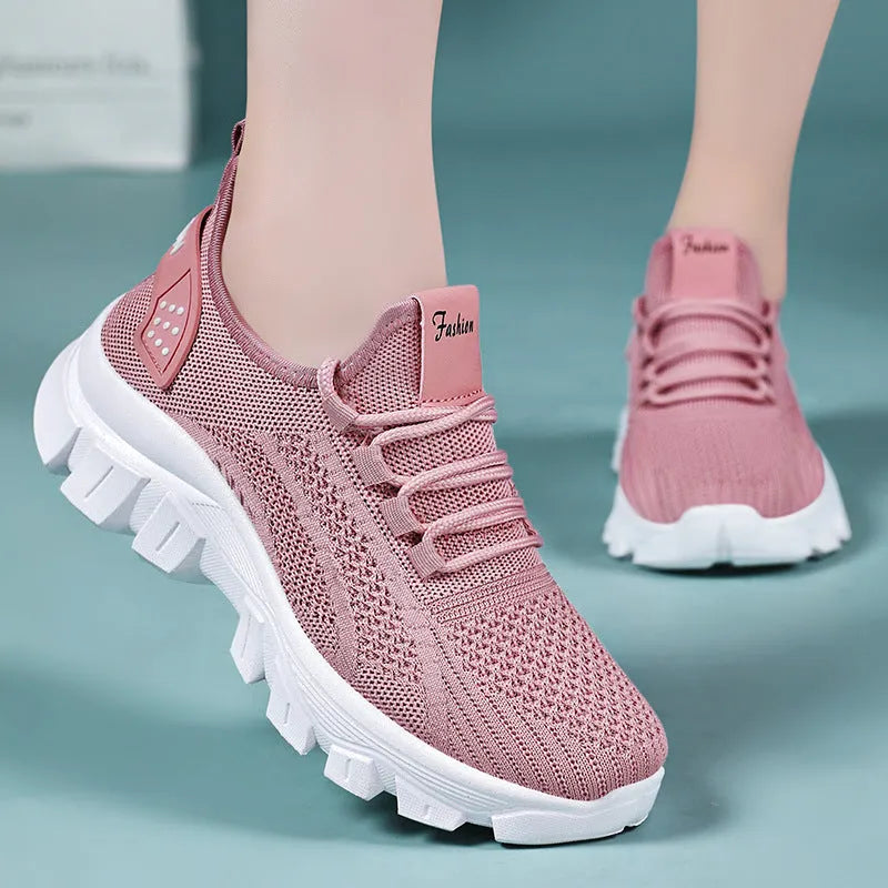Women's white Flyknit sneakers with thick PVC sole and lace-up front