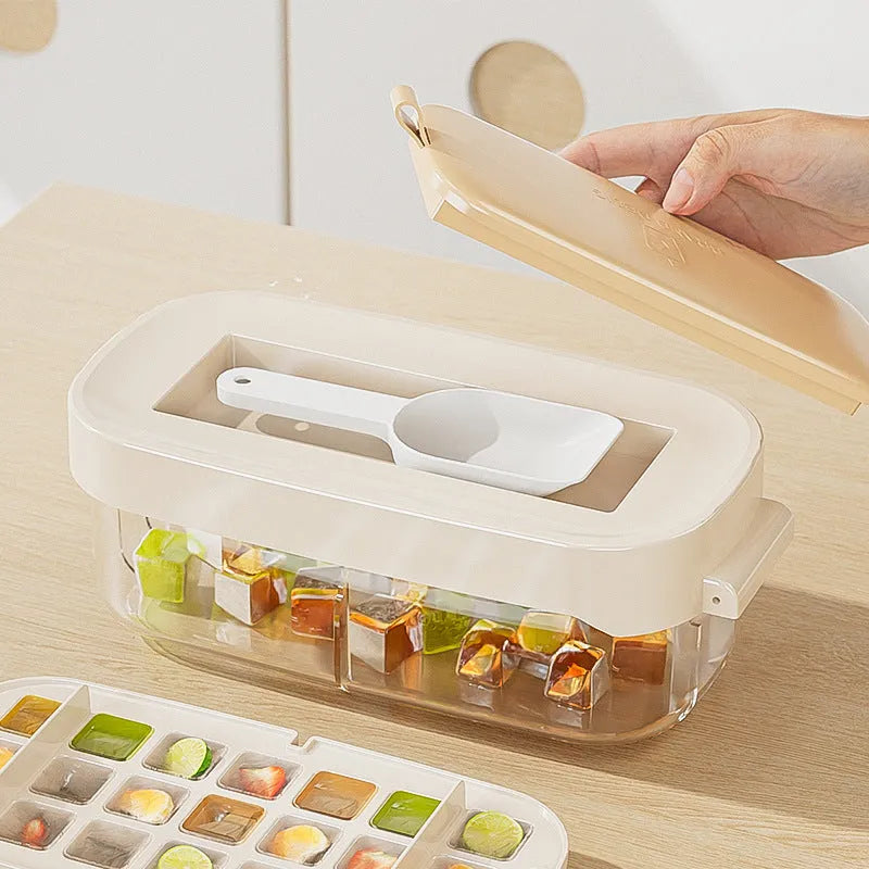 Yellow high-capacity ice cube tray with leverage handle and stored ice shovel.