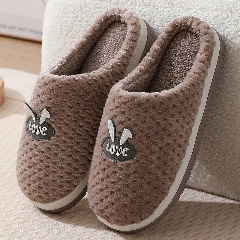 Women's rabbit plaid artificial fur slippers with a thick rubber sole in apricot colour.