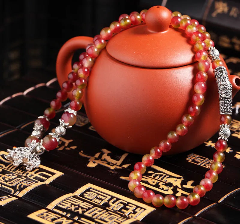 Natural watermelon crystal bracelet with Chinese knot closure and geometric beads