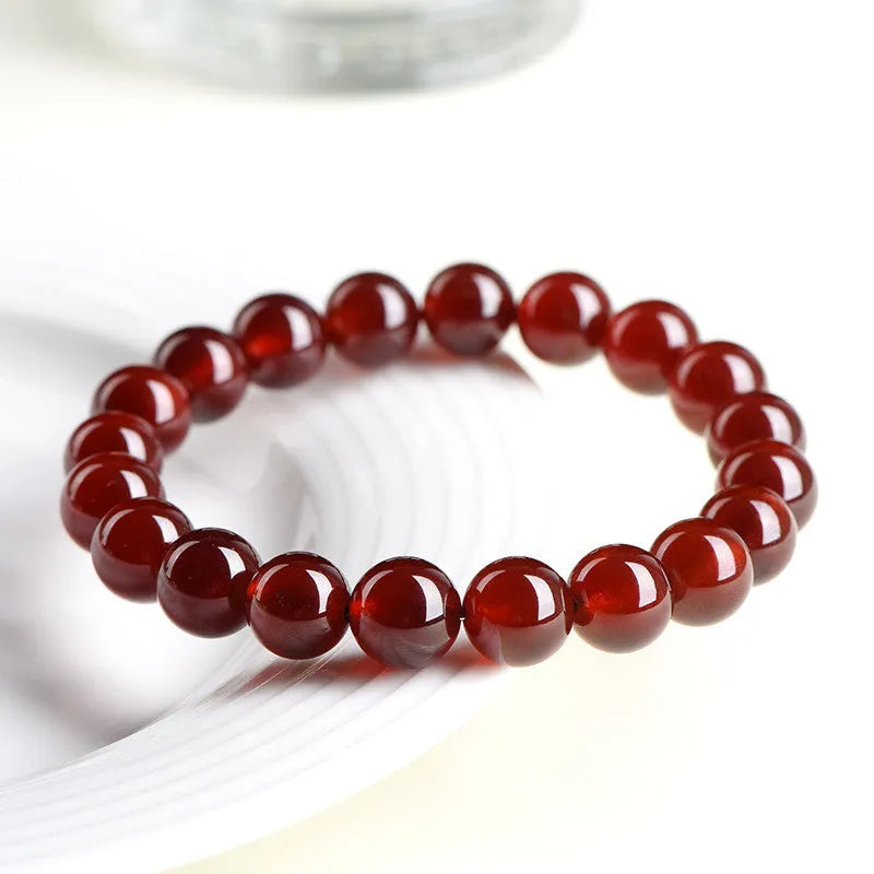 Natural orange red garnet crystal bead bracelet with retro design on wrist