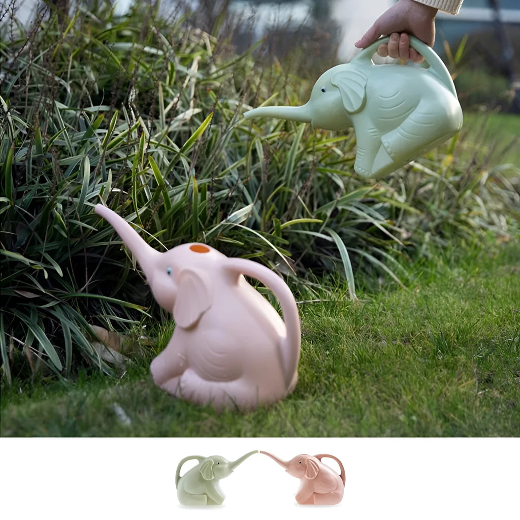 Pink baby elephant-shaped plastic watering can with a long spout on a wooden table.
