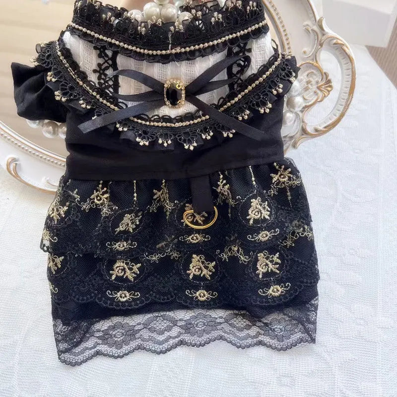 Golden gothic princess-style tiered skirt dress for a small dog or cat on a mannequin.