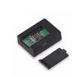 N9 Mini X009 black car GPS tracker alarm with removable back cover showing SIM card slot