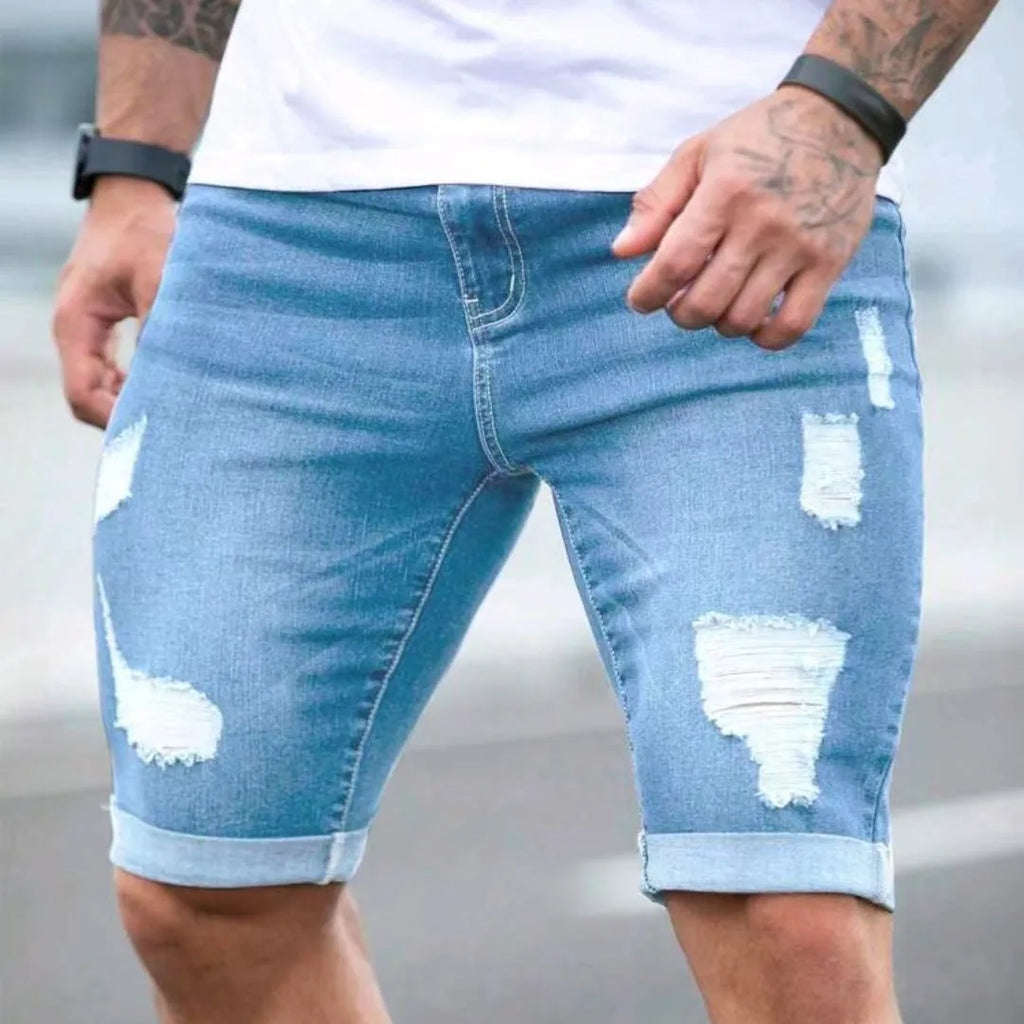 Men's sky blue denim shorts with multi-hole distressed design, low waist straight cut silhouette