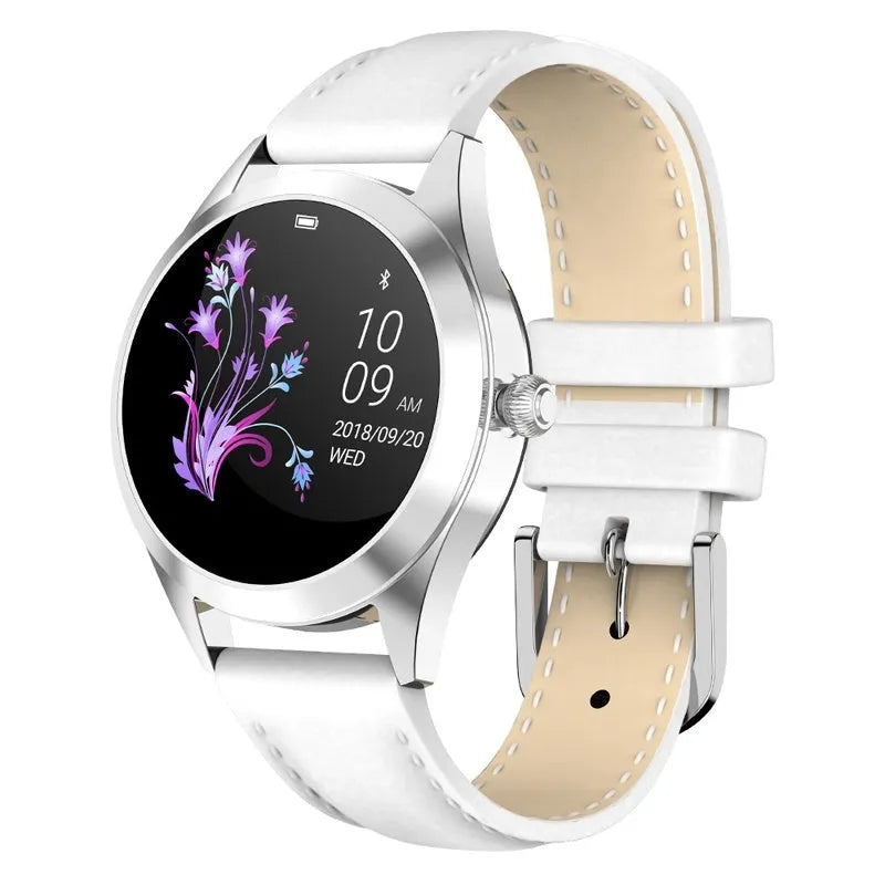 Women's sports smartwatch showing fitness tracking display on wrist, available in black, white, rose gold, and silver.