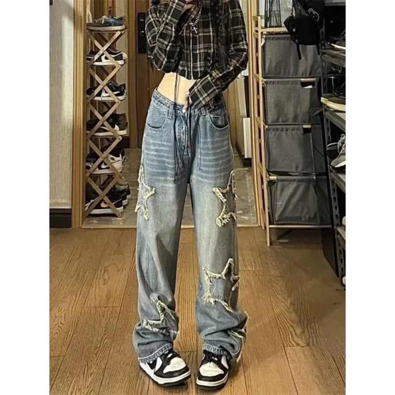 Blue high-waisted wide-leg denim jeans with a straight-leg cut on a model