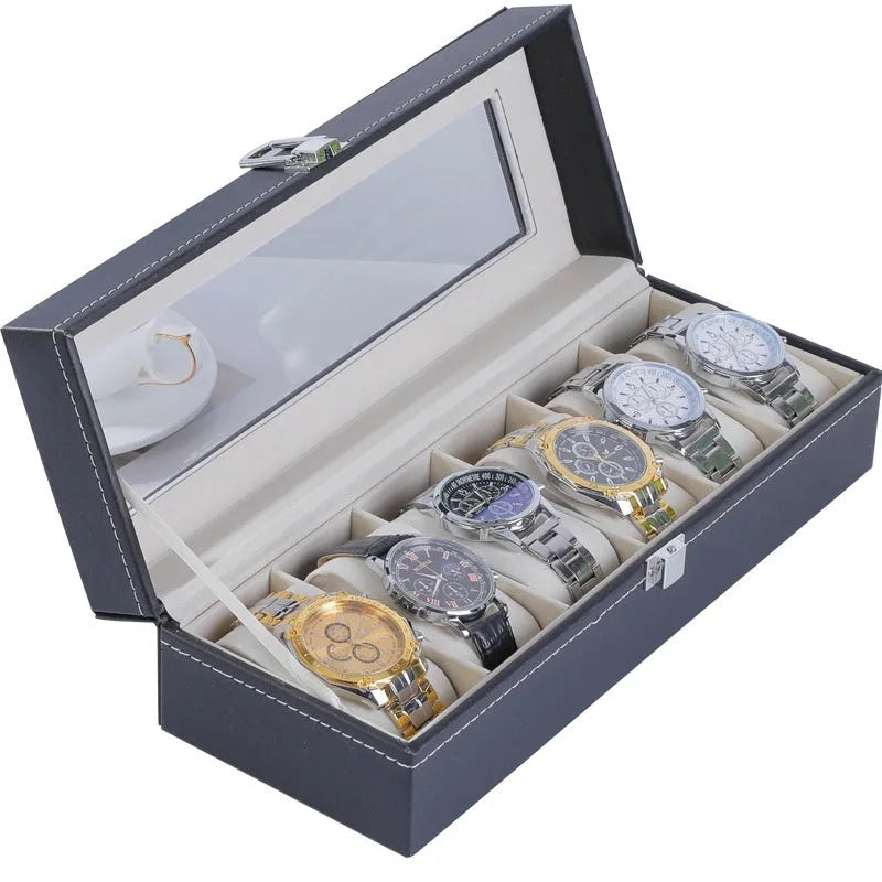 Grey leather watch storage box with clear dustproof lid showing watch cushions inside
