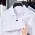 Man wearing a grey long sleeve cotton polo shirt with a lapel collar and loose fit.