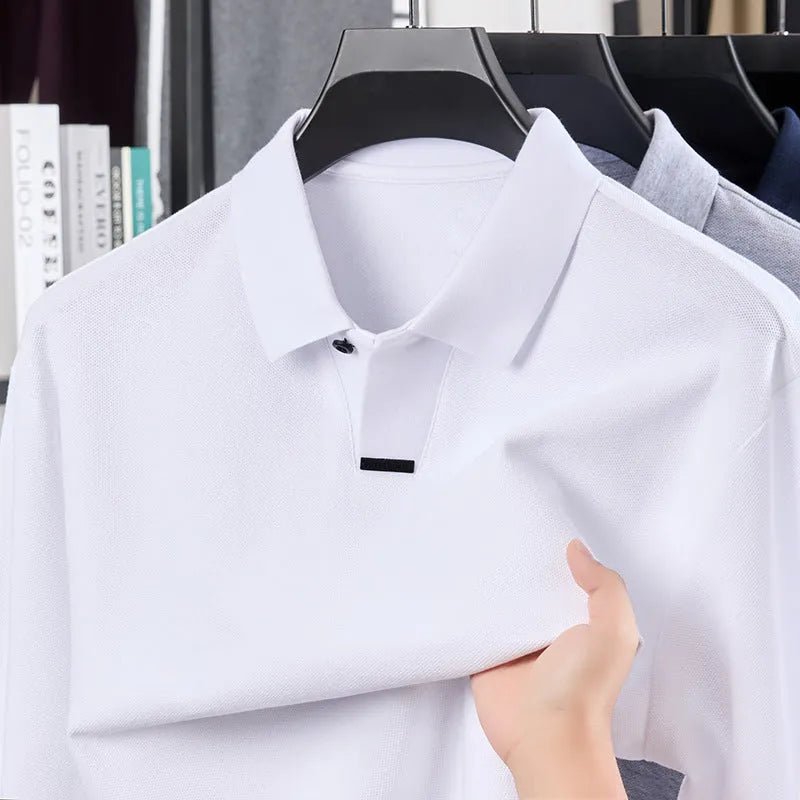Man wearing a grey long sleeve cotton polo shirt with a lapel collar and loose fit.