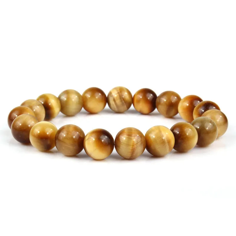 Natural Tigereye crystal bracelet with round beads, showing colour options including dark blue, green, and red tiger eye.