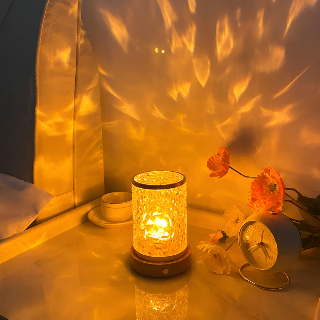 Rotating water ripple night light with acrylic housing on solid wood base showing touch control