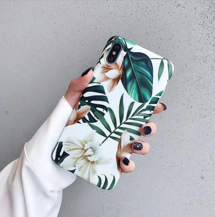 Floral banana leaf design on a flexible TPU phone case for compatible iPhone models.