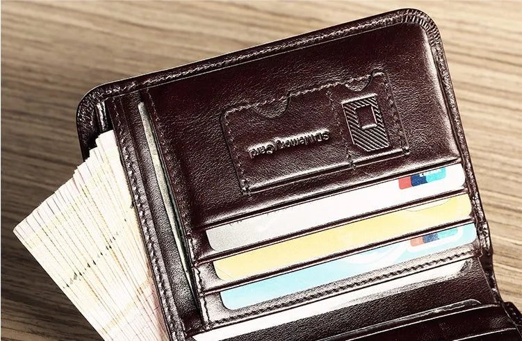Men's brown leather wallet open to show card slots, ID window, coin pocket, and banknote fold.