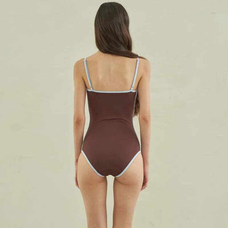 Brown women's one-piece swimsuit with triangle bikini top design and sexy pattern