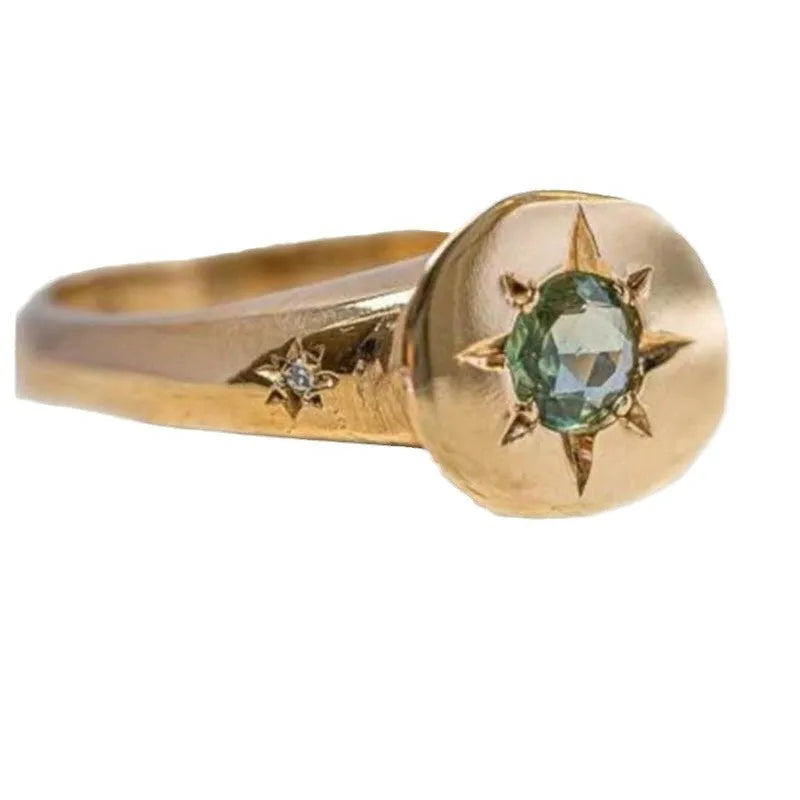 Gold coloured adjustable opening ring with star-shaped zircon design and oval profile