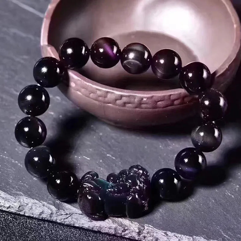 Natural grey obsidian crystal beaded bracelet shown in multiple bead size options on a wrist.