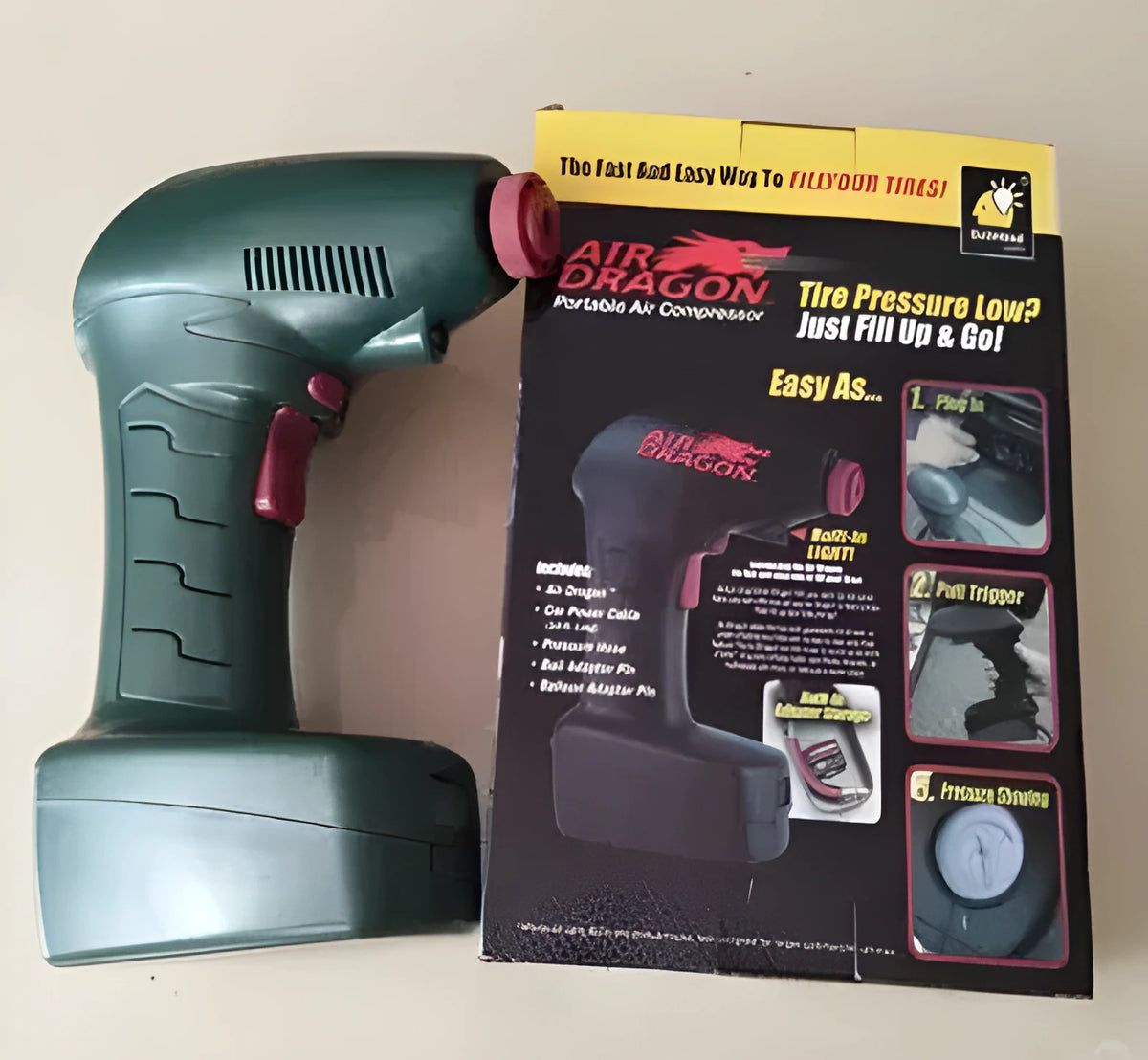 Portable 12V electric car tyre air pump and inflator unit with hose.