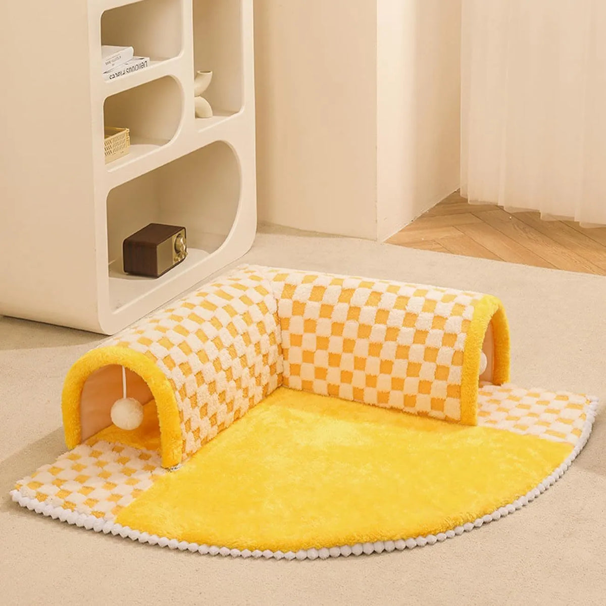 Coffee coloured fan-shaped plush pet bed with a tunnel entrance and anti-slip granular base.