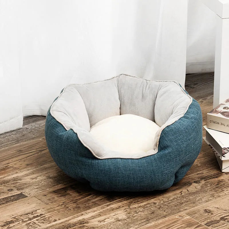 Blue octagonal pet bed with high sides, soft interior, and a removable mat for a cat or small dog.