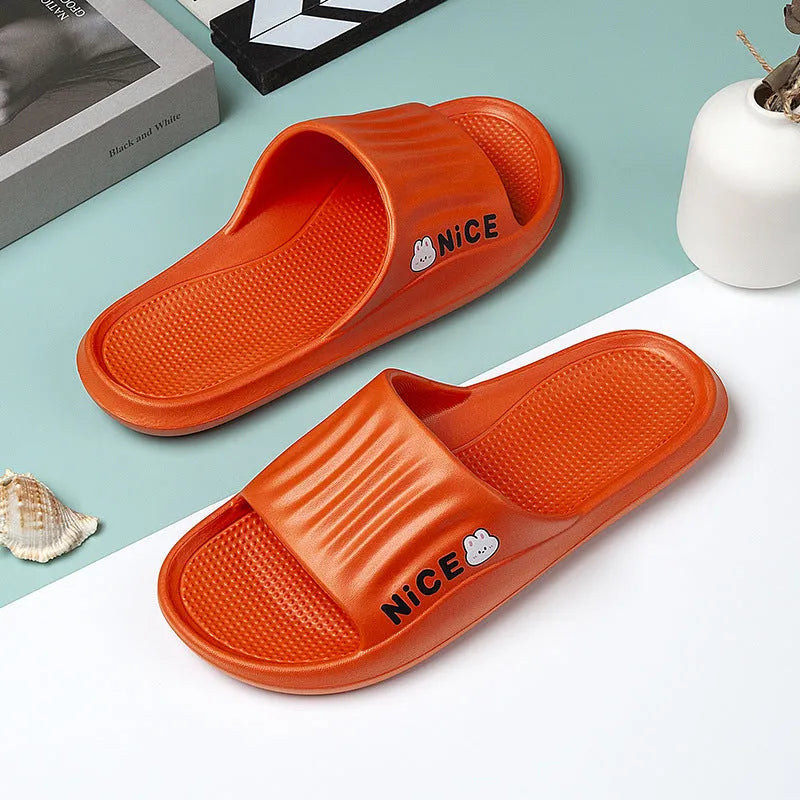 Pair of minimalist cartoon pattern EVA flip flop slippers on a plain background.