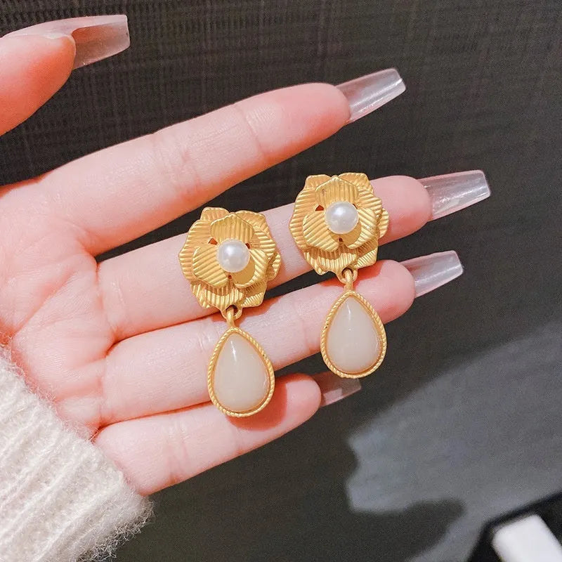 Gold electroplated Hong Kong style stud earrings with needle rose pearl and opal stone design.
