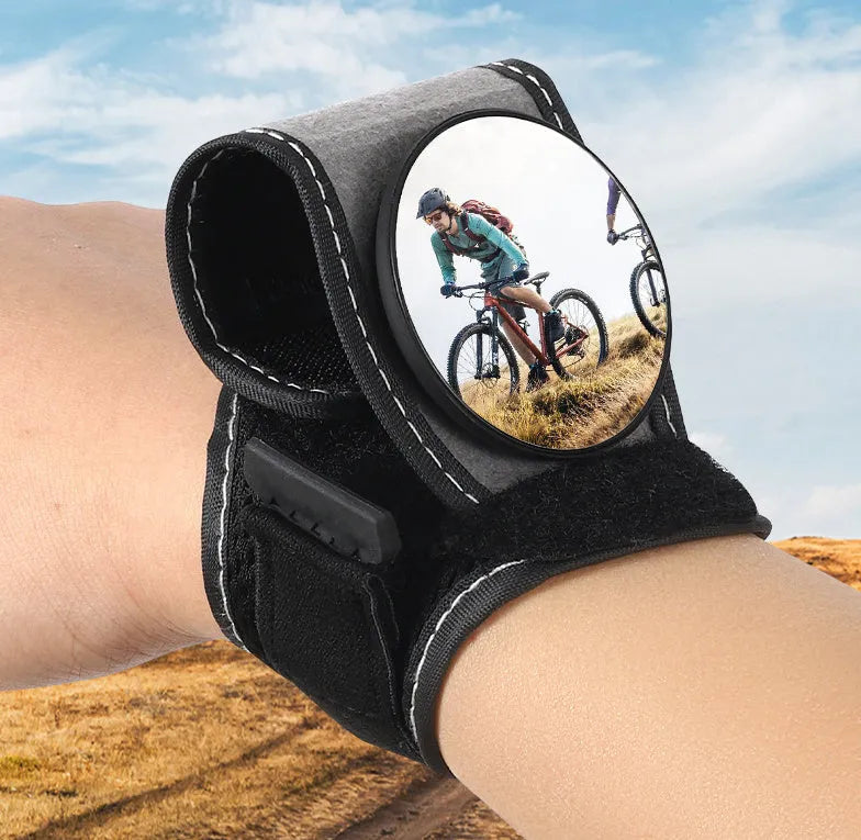 Black nylon cycling rear-view mirror fixture mounted on bicycle handlebars.