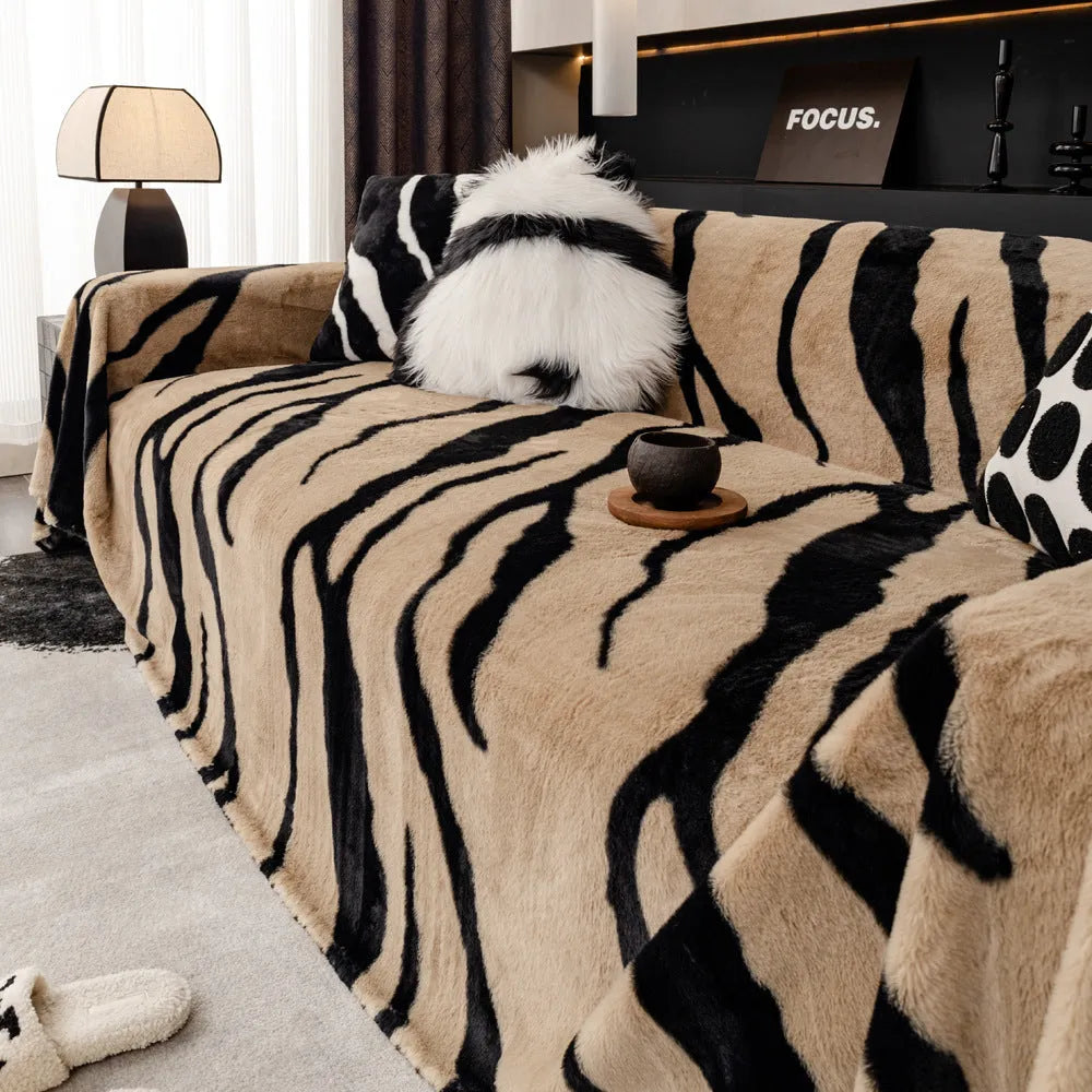 Zebra pattern thickened flannel sofa cover shown in caramel colour with matching pillowcase, demonstrating non-slip fit.