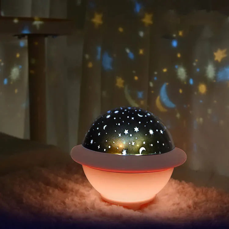 UFO-shaped plastic starry sky projection night light in pink colour with USB cable