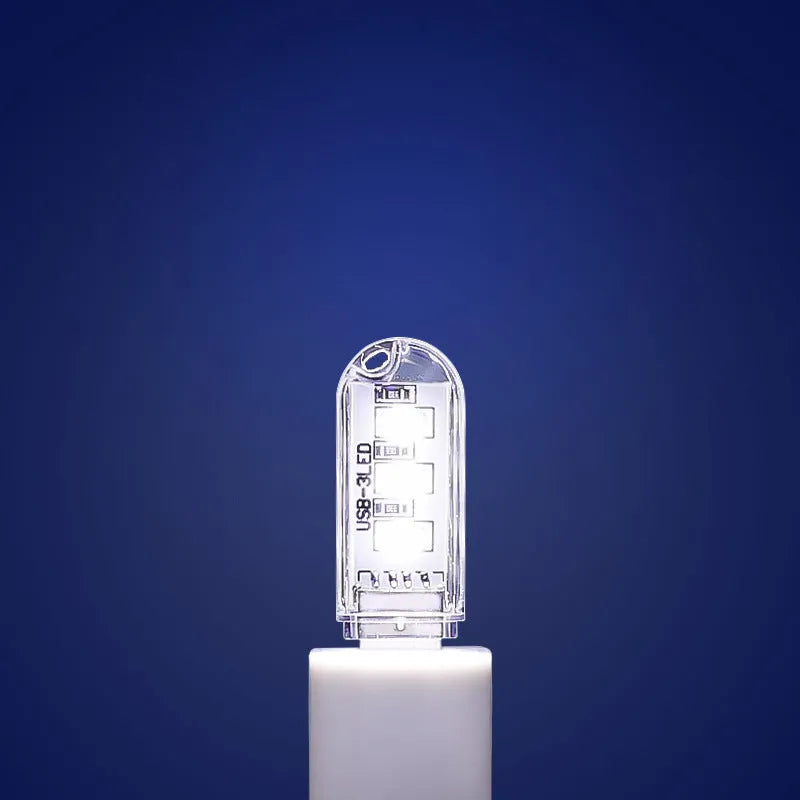 Small white USB LED night light with warm and white light settings.