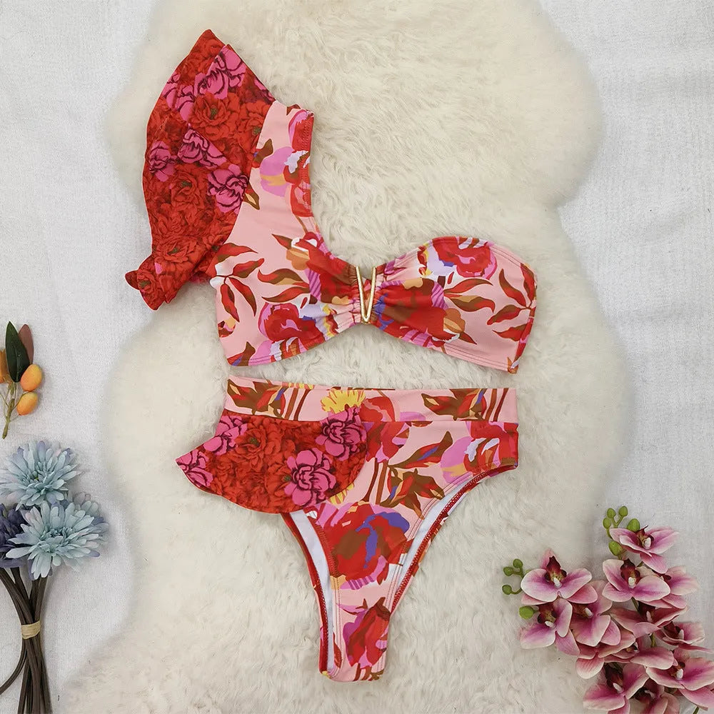 Women's pink floral print one-shoulder swimsuit with high-waist briefs and ruffled detailing