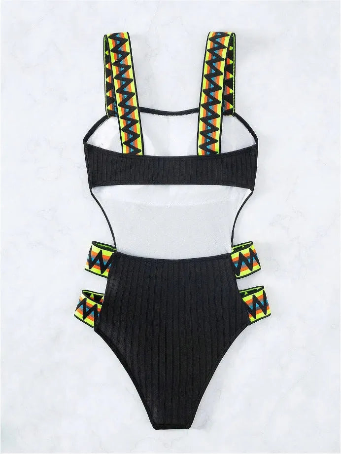 Black solid colour one-piece swimsuit on a mannequin, side view.