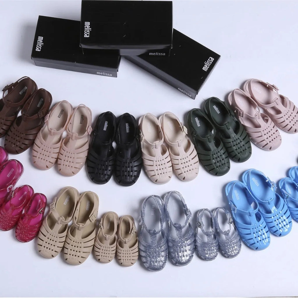 Roman sandals with buckle closure in PVC material showing vintage weave design and hollow-out elements