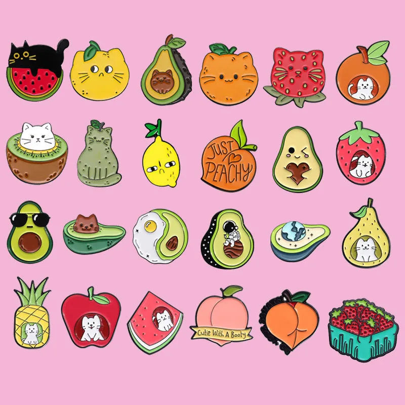 Close-up of a creative cartoon colourful fruit design metal brooch in a letter shape.