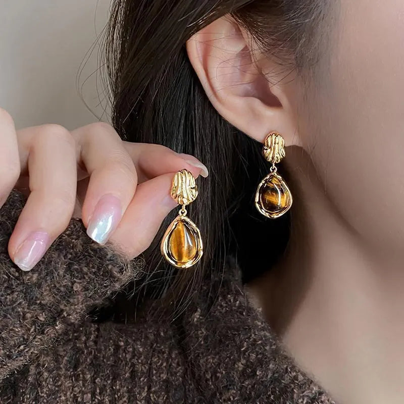 Handmade geometric alloy earrings with tassel elements in three colour options