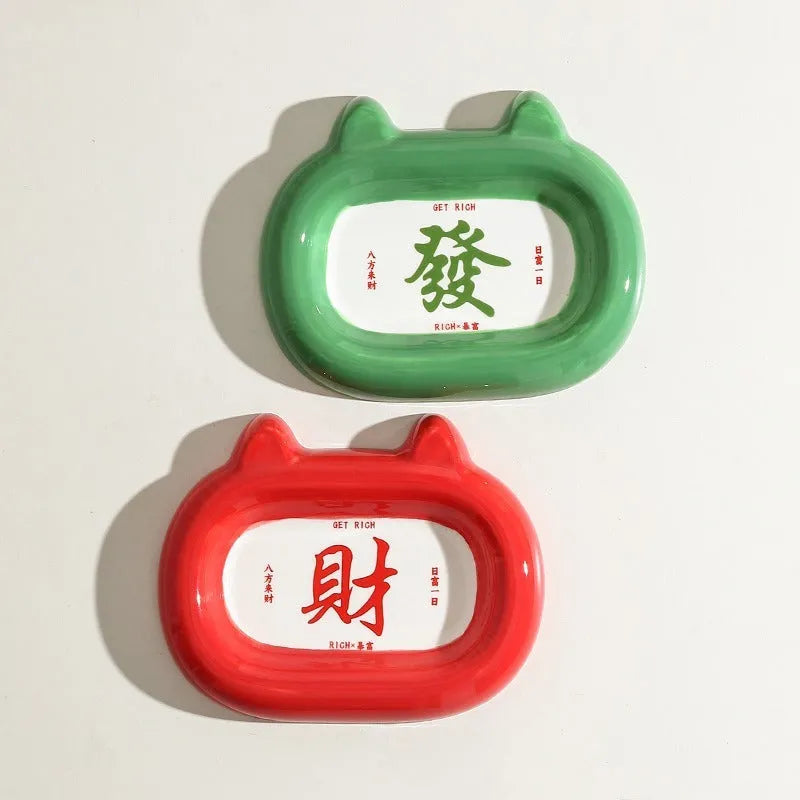Ceramic animal-shaped pet bowl with cat design on stable flat base