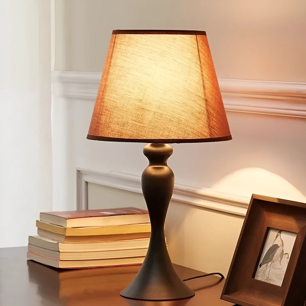 Retro alloy table lamp with LED lighting on wooden surface
