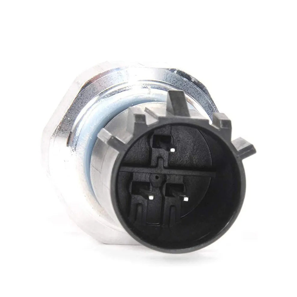 Silver automobile fuel pressure sensor for petrol engine diagnostic testing.