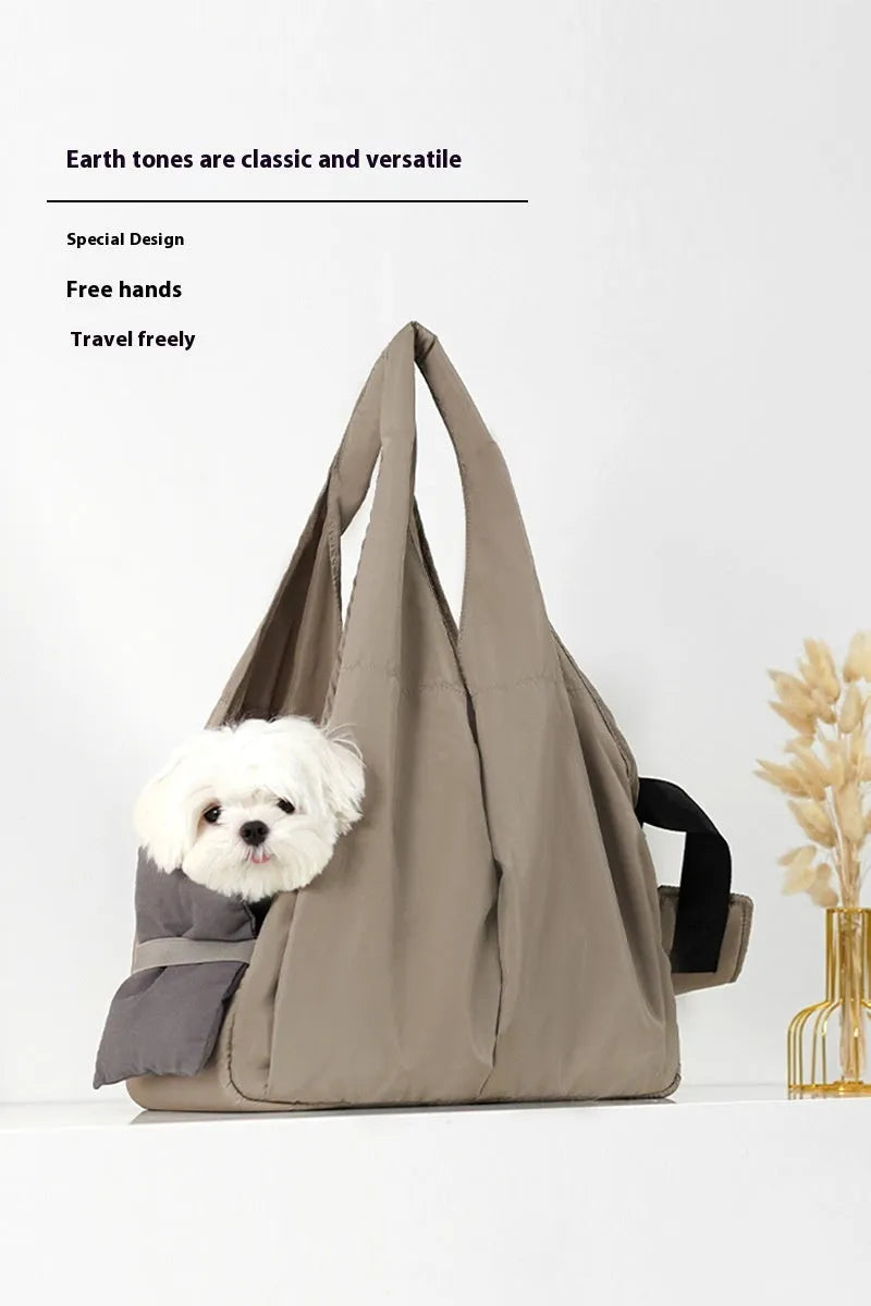 Apricot coloured cloth pet handbag carrier with shoulder strap for small dogs or cats.