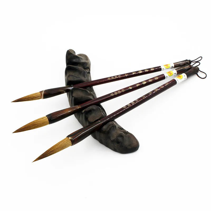 Wolf hair Chinese calligraphy brush with steel rod, shown in large, medium, and small block sizes.