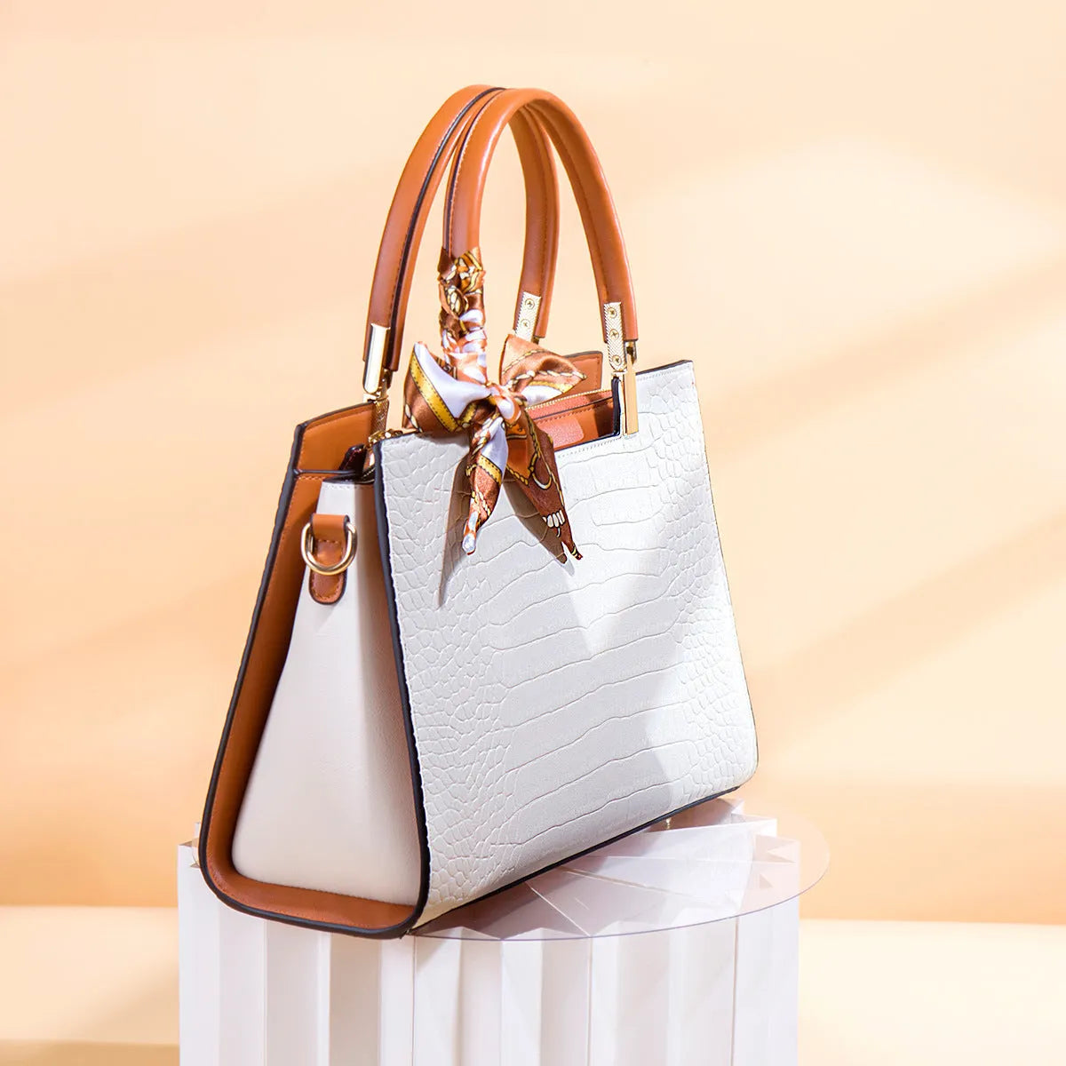 Milky white women's large shoulder handbag with internal compartments and slit pocket.