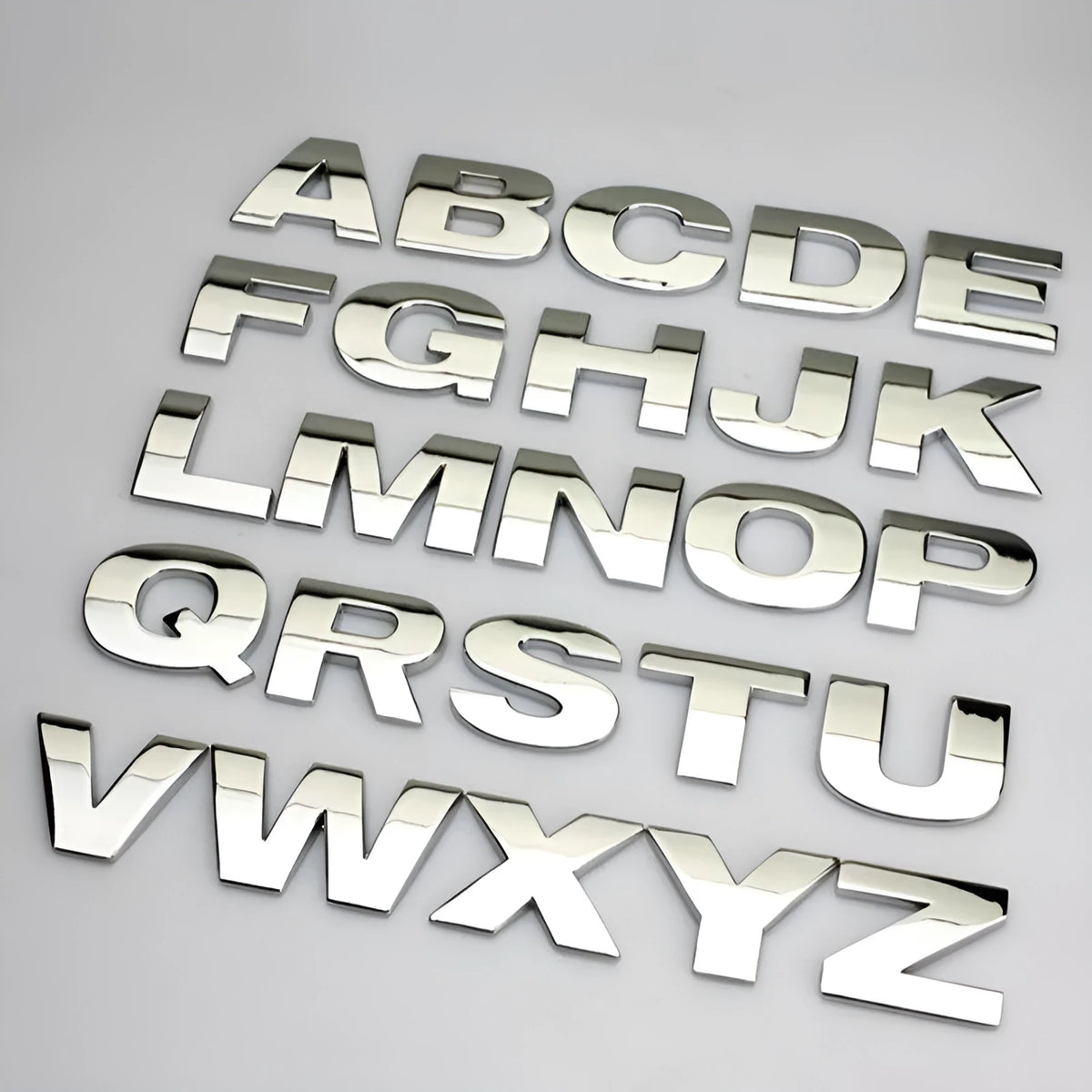 Metal zinc alloy 3D car bumper sticker showing raised English letter, approximately 2.5cm in size