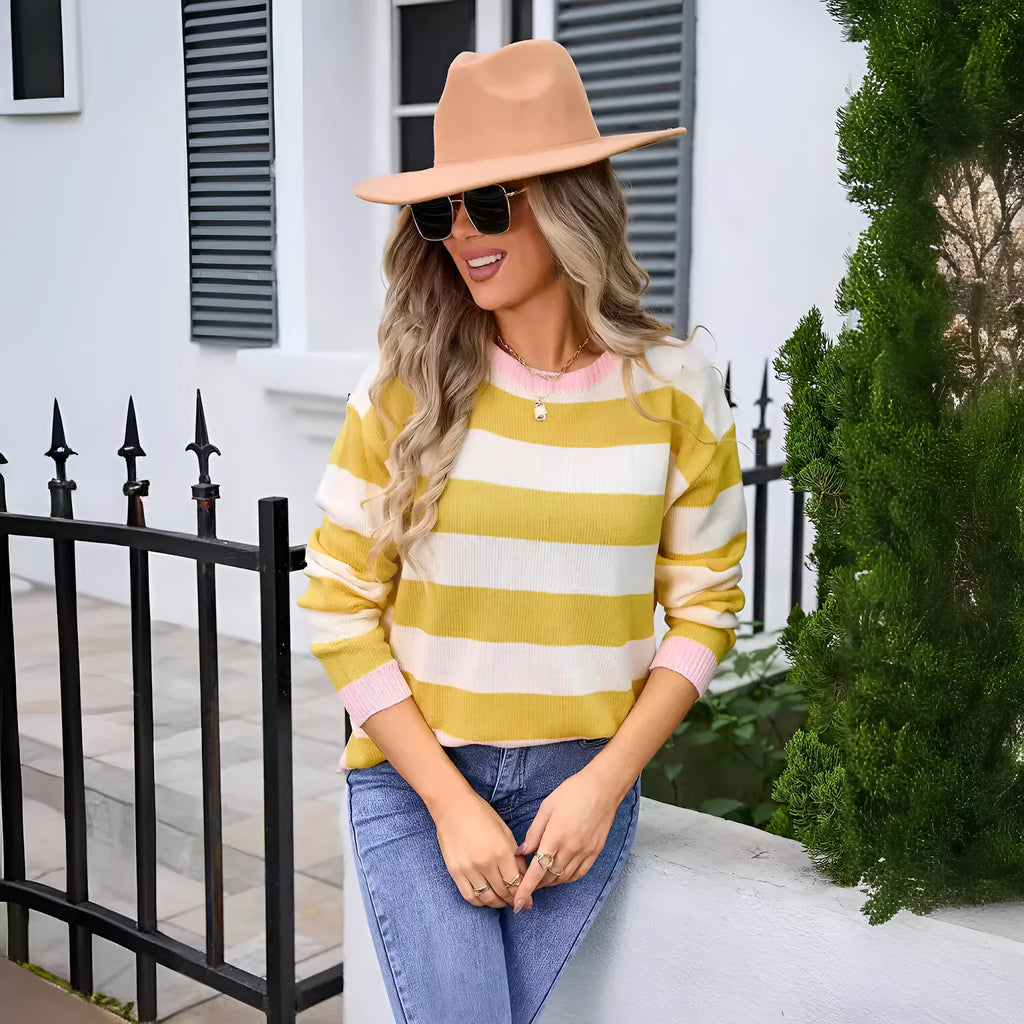 Blue loose-fit women's acrylic sweater with long sleeves and a striped pattern.