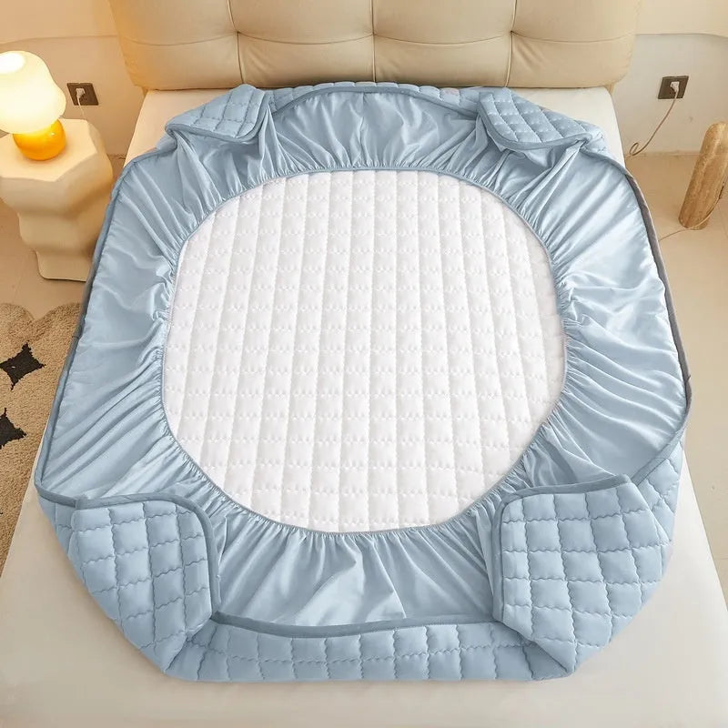 Class A waterproof fitted sheet in washed cotton, shown in light grey colour on a child's mattress.