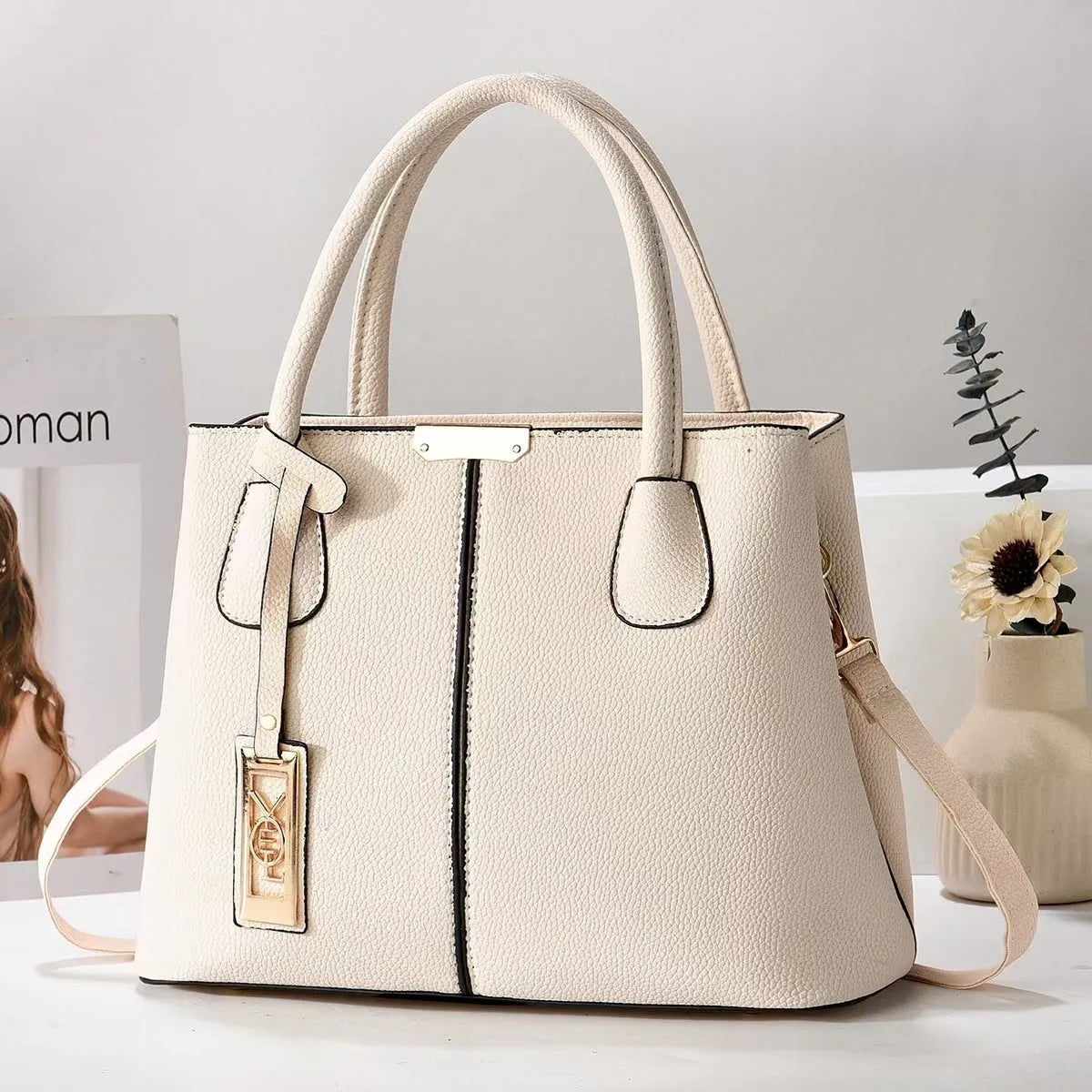 Soft PU leather women's shoulder bag in a horizontal square shape with a single strap.