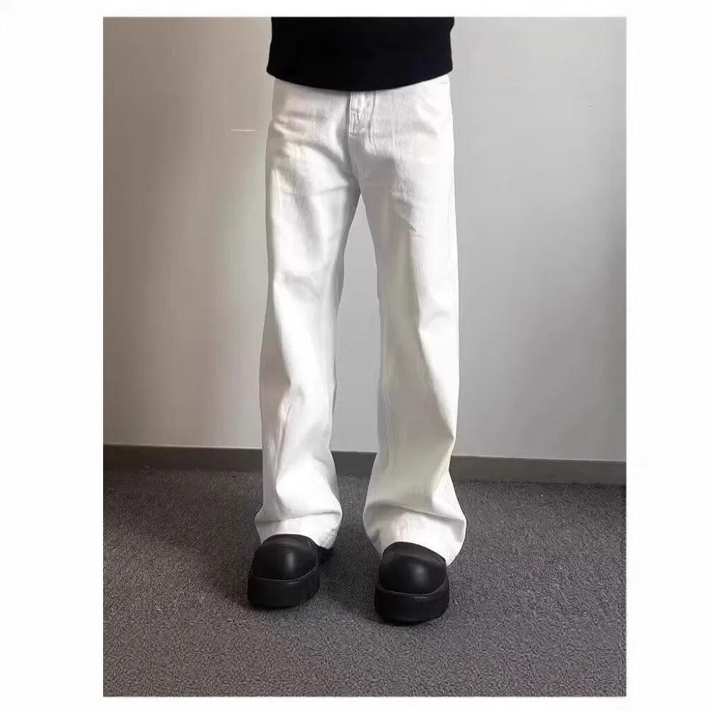 Men's white straight-leg cotton jeans with a mid-rise waist and zipper fly